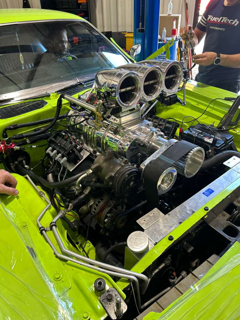 Bright green engine bay during performance work