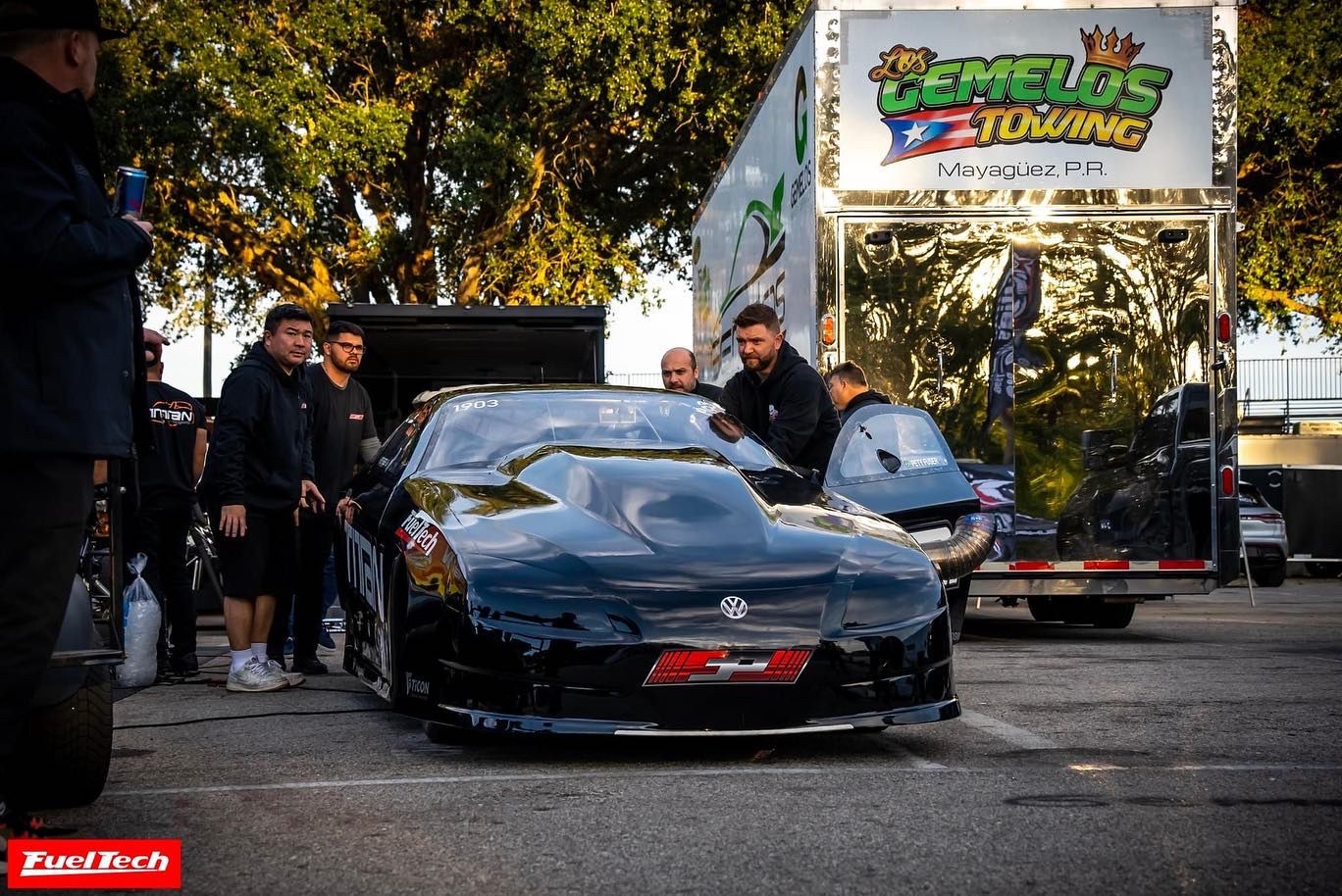Black performance car at a motorsports event